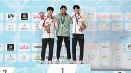 
Antasyafi Robby Al Hilmi naik ke podium setelah meraih gelar juara untuk nomor speed putra pada 11 September 2026. (Xinhua)