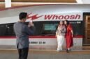 Sejumlah penumpang berpose untuk difoto berlatarkan model rangkaian kereta electric multiple unit (EMU) Kereta Cepat Jakarta-Bandung (KCJB) di ruang tunggu Stasiun Halim di Jakarta (Xinhua)